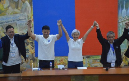 <p><strong>FIRST FEMALE MAYOR</strong>. Mayor-elect Honey Lacuna-Pangan (second from right) with vice mayor-elect Yul Servo Nieto (second from left) after their proclamation Wednesday evening (May 11, 2022) at the Manila City Hall. Lacuna made history after she was proclaimed the first woman mayor of the country's capital. <em>(PNA photo by Avito Dalan)</em></p>