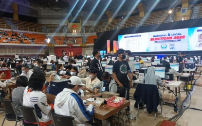 <p><strong>STILL COUNTING</strong>. Parish Pastoral Council for Responsible Voting volunteers count election returns manually as they continue to arrive on Wednesday (May 11, 2022) at the PPCRV Command Center in UST Campus, Manila. Election Returns from some voting areas in the Visayas are expected to arrive Wednesday. <em>(PNA photo by Wilnard Bacelonia)</em></p>