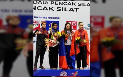 <p><strong>PROUD FILIPINO.</strong> Pencak silat’s bet Mary Francine Padios (2nd from left) poses with fellow medalists after winning the country’s first gold in the ongoing 31st Southeast Asian Games in Vietnam on Wednesday (May 11, 2022). Senator Sonny Angara said the government should continue to recognize the Filipino athletes’ achievements and dedication to bring home honor for the country. <em>(Photo courtesy to Philsilat Sports Association Facebook Page)</em></p>