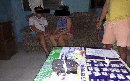<p><strong>DRUG BUST</strong>. Live-in couple Pearl Je-Ann Elera, 26, and Reigel Troy Quimba, 20, are arrested during a buy-bust in Purok Kapawa, Barangay Punta Taytay, Bacolod City on Friday (May 13, 2022). The suspects yielded PHP1.183 million worth of suspected shabu, a police report said. <em>(Photo courtesy of Bacolod City Police Office)</em></p>