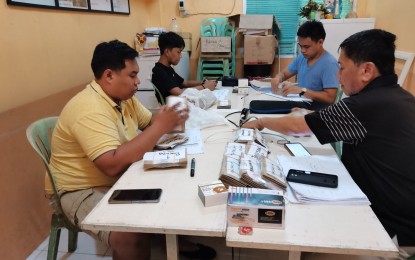 <p><strong>PARALLEL COUNT.</strong> The Parish Pastoral Council for Responsible Voting in Negros Oriental continues to gather the fourth copies of the election returns from the May 9 polls. The local PPCRV is facing a dilemma as 120 out of the 1,471 clustered polling precincts have not yet released the ERs. <em>(Photo by Judy Flores Partlow)</em></p>