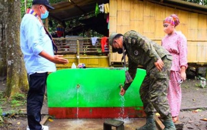 <p><strong>DEVELOPMENTAL PROJECTS.</strong> Maj. Gen. Ignatius Patrimonio (center), Joint Task Force-Sulu commander, tests the water system in Barangay Bakung, Patikul, Sulu on Friday (May 13, 2022). Housing and other infrastructure projects were inaugurated for residents who are back in the community that was ravaged by Abu Sayyaf Group bandits for two decades. <em>(Photo courtesy of JTF-Sulu)</em></p>
