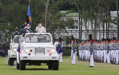 <p><strong>‘BAGSIK DIWA’.</strong> President Rodrigo Roa Duterte salutes past the color guard while onboard the command car in the trooping the line ceremony during the Philippine Military Academy commencement exercises at the Fajardo Grandstand, Borromeo Field in Fort Gen. Gregorio H. del Pilar, Baguio City on Sunday (May 15, 2022). Duterte called on new PMA graduates to “be both a warrior and peacemaker” while ensuring they always remained true to their oath. <em>(Presidential photo by Rey Baniquet)</em></p>