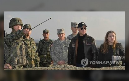<p><strong>DMZ TRIP</strong>. This file photo, taken Dec. 7, 2013, shows US Vice President Joe Biden (2nd from R) visiting the Demilitarized Zone separating the two Koreas. Past US presidents visited the DMZ during their trips to South Korea. <em>(Pool photo/Yonhap)</em></p>