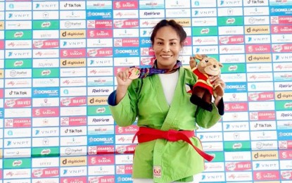 <p>Staff Sergeant Estie Gay Liwanen proudly shows her bronze medal during the awarding ceremony for the Kurash Women 57-kilograms event of the 31st Southeast Asian Games in Hanoi, Vietnam on May 16, 2022. <em>(Photo courtesy of PA) </em></p>