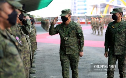 <p><strong>SALUTE.</strong> Armed Forces Chief of Staff Gen. Andres Centino (center) greets Philippine Army staff and personnel during a visit at their headquarters in Fort Bonifacio, Taguig on April 12, 2022. He is the longest-serving military chief since 2014 as he will be in office for 449 days or until he reaches the compulsory retirement age of 56 on Feb. 4, 2023.<em> (Photo courtesy of PH Army Facebook)</em></p>