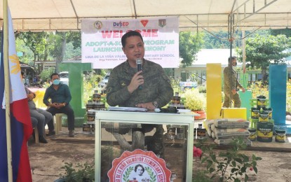 <p><strong>PARTNERSHIP.</strong> Lt. Col. J-jay Javines, commanding officer of the Army’s 79th Infantry Battalion, speaks during the launch of the unit’s “Adopt-A-School” program at the Lina De La Viña Valmayor Elementary School in San Carlos City, Negros Occidental on Monday (May 16, 2022). In partnership with the city government, the 79IB turned over construction materials to the school officials.<em> (Photo courtesy of 79th Infantry Battalion, PA)</em></p>