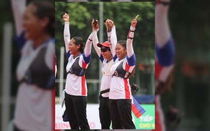 <p><strong>ARCHERY GOLD</strong>. Archers Pia Bidaure, Abby Bidaure and Phoebe Amistoso celebrate after the gold medal in the women’s recurve team in the ongoing 31st SEA Games in Hanoi, Vietnam on Wednesday (May 18, 2022). It was the first gold contributed by the archery for the Team Philippines. <em>(Photo courtesy of Team Philippines)</em></p>
