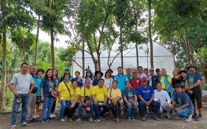 <p><strong>GREENHOUSES</strong>. The Korea Program on International Agriculture (KOPIA) Center in the Philippines has turned over a total of 13 greenhouses to farmers’ associations in Zaragoza, Nueva Ecija. The beneficiaries who are members of two associations are shown in this undated photo. <em>(Photo courtesy of DA-PhilRice)</em></p>