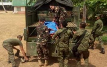 <p><strong>SACRIFICE</strong>. Soldiers load a body of a trooper killed in an attack by the New People's Army in Laoang, Northern Samar on May 21, 2019. The military has built a flagpole inside a school where Sgt. Alex Saliwan was slain to honor his sacrifice. <em>(Photo courtesy of Philippine Army)</em></p>