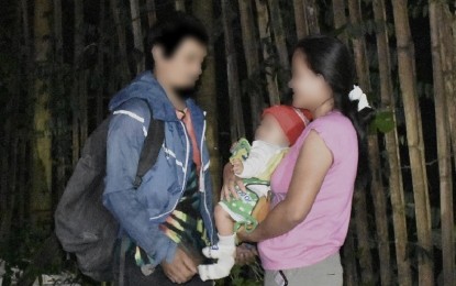 <p><strong>REUNITED.</strong> “Ka Jayto” (left), a New People’s Army member for 10 years, sees his wife and child again after surrendering to the Philippine Army’s 16th Infantry Battalion under the 402nd Infantry Brigade in Malitbog, Bukidnon on May 18, 2022. His wife and rebel medic, “Renchie”, surrendered six days earlier and facilitated Ka Jayto’s return to the fold of the law. <em>(Photo courtesy of PA 6IB)</em></p>