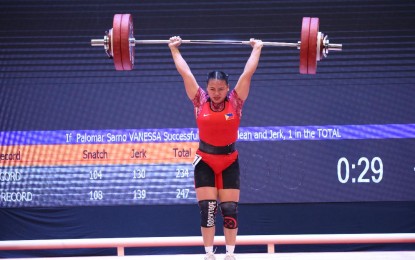 <p><strong>NEW SEAG RECORD</strong>. Young reigning Asian champion Vanessa Sarno breaks the Southeast Asian Games record in women’s 71kg division competition of weightlifting in the 31st Hanoi SEA Games on Saturday (May 21, 2022). Vanessa, 18, set new records of 104kg in the snatch, 135kg in the clean and jerk, and 239kg total in delivering the country’s fourth win for the day. <em>(Photo courtesy of Team Philippines)</em></p>