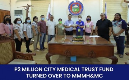 <p><strong>MEDICAL TRUST FUND</strong>. Officials of the city government of Batac led by mayor Albert Chua turn over PHP2 million worth of medical trust fund to the Mariano Marcos Memorial Hospital and Medical Center on May 18, 2022. The fund will be used exclusively for indigents, needy, and less fortunate residents not covered by the Philippine Health Insurance Corporation. <em>(Photo courtesy of City Government of Batac)</em></p>