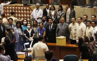 <p><strong>CANVASSING OF VOTES</strong>. Members of the Senate and House of Representatives face the media at the start of the canvassing of votes for president and vice president at the Batasang Pambansa in Quezon City on Tuesday (May 24, 2022). Senate President Vicente Sotto III (11th from left) and House Speaker Lord Allan Velasco (12th from left) presided over the joint session of the Congress.<em> (PNA Photo by Avito Dalan)</em></p>