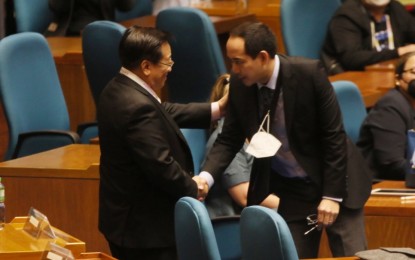 <p><strong>NO OBJECTION</strong>. Lawyer Vic Rodriguez (right), legal counsel of presumptive President Ferdinand "Bongbong" Marcos Jr., greets election lawyer Romulo Macalintal, legal counsel of presidential candidate Vice President Leni Robredo, during the proceeding of canvassing of votes of the president and vice president at the House of Representatives, Batasan Hills, Quezon City on Tuesday (May 24, 2022). Macalintal said Robredo's camp will not object to the inclusion of all certificates of canvass for president and will waive its appearance before the joint canvassing committee.<strong><em> (PNA photo by Avito C. Dalan)</em></strong></p>
