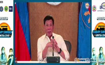 <p><strong>RESBAKUNA</strong>. President Rodrigo Roa Duterte thanks all frontline healthcare workers and senior citizens for getting their second booster shots in his video message during the Resbakuna ceremonial vaccination for 2nd booster dose at SM Megamall in Mandaluyong City on Thursday (May 26, 2022). He said the government is committed to keep Filipinos safe and healthy as the country continues to recover from the impact of Covid-19 pandemic.<em> (Screengrab from RTVM)</em></p>