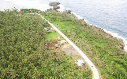 <p><strong>TOURIST HAVEN.</strong> The road leading to Canhugas Nature Park in Hernani, Eastern Samar. The destination is now more accessible after the recent completion of the PHP27.35 billion road leading to the site. <em>(Photo courtesy of the Department of Public Works and Highways)</em></p>
