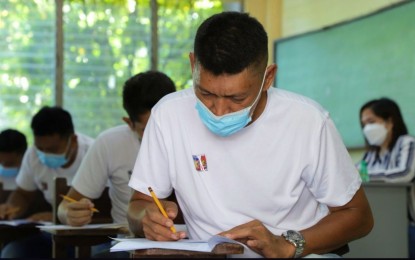 <p><strong>POLICE HOPEFULS.</strong> Former Moro rebels hoping to be part of the Philippine National Police take the National Police Commission special qualifying examinations in Cotabato City and Lamitan City, Basilan Sunday (May 29, 2022). More than 11,000 former members of the Moro Islamic Liberation Front and the Moro National Liberation Front took the exams. <em>(Photo courtesy of OPAPRU)</em></p>