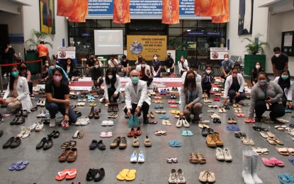 <p><strong>GRIM REMINDERS.</strong> A total of 321 pairs of shoes and slippers owned by fatalities of smoking-related diseases are on display at the main lobby of the Lung Center of the Philippines in Quezon City on Tuesday (May 31, 2022). The number symbolizes the average daily death toll in the country caused by tobacco products. <em>(PNA photo by Jess M. Escaros Jr.)</em></p>