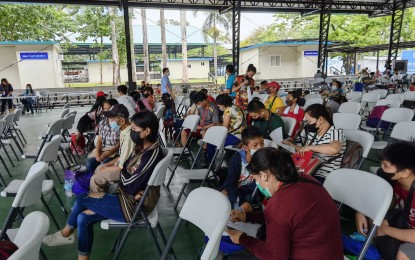 <p><strong>FRESH START.</strong> Some of the 107 individuals who are set to return to Negros Oriental, Bohol, Cebu, and Iloilo through the government's Balik Probinsya, Bagong Pag-Asa program, undergo orientation and dispatch proceedings at the BP2 Depot in Agham Road, Quezon City on Wednesday (June 1, 2022). They will depart Manila on June 2, 2022.  <em>(PNA photo by Lade Kabagani) </em></p>