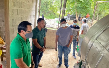 <p><strong>SWITCH-ON</strong>. Re-elect Mayor Pablito Sanidad leads the ceremonial switch-on of the town composting facility on Wednesday (June 1, 2022), which will be used at the municipal dumpsite in Barangay Sucoc, Narvacan, Ilocos Sur. The facility is in support of the town’s sustainable waste management program and compliance with RA 9003. <em>(Photo courtesy of Narvacan LGU) </em></p>