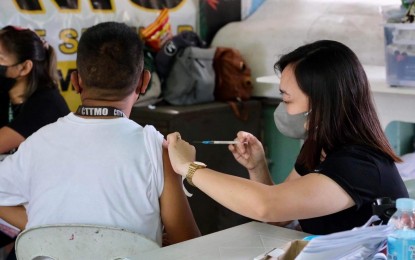 <p><strong>‘GET VAXXED’.</strong> A Davao City resident gets vaccinated in this undated photo. The city government on Thursday (June 2, 2022) issued a warning anew to those who remain unvaccinated, saying three recent deaths from Covid-19 involved individuals who chose not to get the jabs.<em><br />(Photo from the City Government of Davao)</em></p>