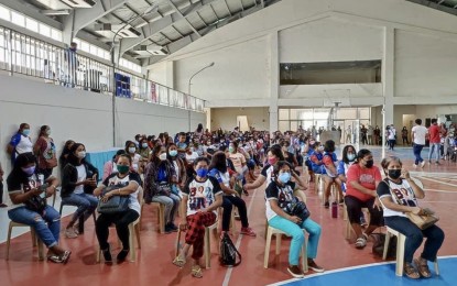 <p><strong>PAID RISK.</strong> Barangay healthcare workers (BHWs) in Pagudpud, Ilocos Norte line up on June 1, 2022 at the Pagudpud Gymnasium to receive their Special Risk Allowance (SRA) worth PHP1,428 each. The amount is being funded by the Department of Health.<em> (Photo courtesy of Pagudpud LGU) </em></p>