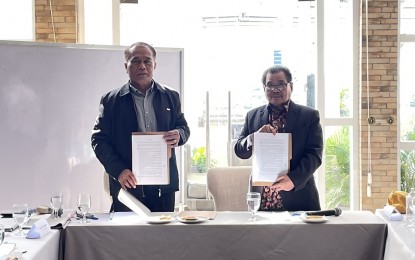 <p><strong>CONTINUING PEACE PROCESS.</strong> Office of the Presidential Adviser on Peace, Reconciliation, and Unity Undersecretary David Diciano (left) and Moro Islamic Liberation Front Peace Implementing Panel chairperson Mohagher Iqbal sign a mutual commitment for the continuing Mindanao peace process in Manila on June 3, 2022. Among others, the agreement includes dialogues on the remaining issues on the implementation of the normalization process to ensure inclusive solutions for the interest and welfare of the Bangsamoro. <em>(Photo courtesy of OPAPRU)</em></p>