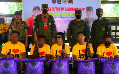 <p><strong>ASG SURRENDERERS.</strong> Five members of the Abu Sayyaf Group (ASG) receive a sack of rice each as initial assistance from the government after their surrender on Sunday (June 5, 2022) in Patikul, Sulu. The Army's 45th Infantry Battalion facilitated the surrender of the ASG fighters, in collaboration with community stakeholders. <em>(Photo courtesy of 45IB)</em></p>