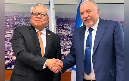 <p><strong>EXPANDING ECONOMIC TIES</strong>. Department of Trade and Industry Secretary Ramon Lopez (left) and Israel Finance Minister Avigdor Lieberman (right) shake hands after signing the Investment Promotion and Protection Agreement (IPPA) between the Philippines and Israel in Jerusalem, Israel on June 7, 2022. The IPPA aims to boost bilateral economic ties between the two countries. <em>(Photo courtesy of DTI)</em></p>