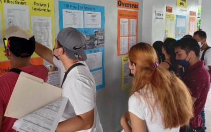 <p><strong>JOB HUNTING.</strong> Job seekers checking a list of vacancies at the Tacloban City Public Employment Service Office (PESO) in this April 22 photo. At least 500 local jobs are available for pandemic-hit job seekers in Eastern Visayas on Independence Day (June 12), the Department of Labor and Employment field office said on Wednesday (June 8, 2022). <em>(Photo courtesy of Tacloban PESO)</em></p>
