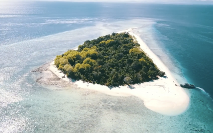<p><strong>PRISTINE BEAUTY.</strong> An aerial shot of one of the majestic white-sand islands in Tawi-Tawi province located in the Bangsamoro Autonomous Region in Muslim Mindanao. Mindanao is reaping "dividends of peace", particularly in the Bangsamoro Autonomous Region in Muslim Mindanao, now the second fastest-growing region in the country in terms of economic activity, according to Secretary Carlito Galvez Jr., Presidential Adviser on Peace, Reconciliation and Unity. <em>(Screengrab from Project Lupad)</em></p>