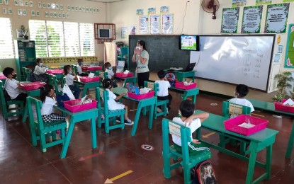 <p><strong>FACE-TO-FACE</strong>. Learners of the Donato Pison Sr. Memorial School in Mandurriao district in Iloilo City hold their limited face-to-face classes starting May 16, 2022. The Schools Division of Iloilo City is eyeing to open all the 66 public schools to limited face-to-face classes next school year. <em>(Photo courtesy of Iloilo City Assistant Schools Division Superintendent Dannie Clark Uguil)</em></p>