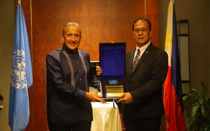 <p><strong>RECOGNITION.</strong> United Nations Resident Coordinator in the Philippines, Gustavo González (left), hands a plaque of recognition to Presidential Peace Adviser, Secretary Carlito Galvez Jr., at the Makati Diamond Residences on Wednesday (June 8, 2022). The UN agency lauded Galvez’s commitment and professionalism in peace-building efforts. <em>(Photo courtesy of OPAPRU)</em></p>