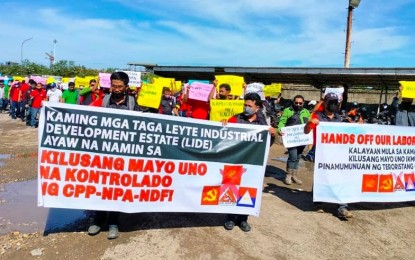 <p><strong>ABANDONING NPA IDEOLOGY.</strong> Members of the Nakahiusang Progresibo ug Demokratikanhong Mamumuo sa Philphos (Naprodmaphil), a labor union of the workers of Philippine Phosphate Fertilizer Corporation (Philphos) in Isabel, Leyte, join an indignation rally, criticizing the Communist Party of the Philippines-New People’s Army on Sunday (June 12, 2022). The group also formally pledged allegiance to the government. <em>(Photo courtesy of Philippine Army)</em></p>