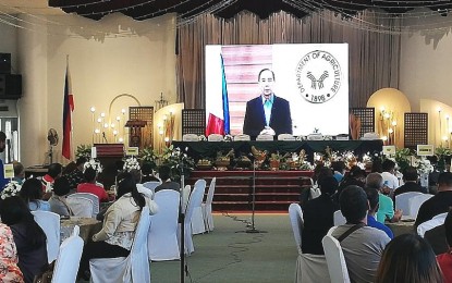 <p><strong>CONSOLIDATION</strong>. Farmers and Fisherfolks from North Luzon listen to Agriculture Secretary William Dar during the opening of the four-day Department of Agriculture (DA)-Farmer Fisheries, Consolidation Cluster (F2C2) island-wide cluster summit 2022 at the Hotel Supreme in Baguio City on Tuesday (June 14, 2022). Dar, in a video message during the opening program, said the DA will continue to advance the interest of fisherfolk and farmers through consolidation. <em>(PNA photo by Liza T. Agoot)</em></p>
