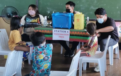 <p><strong>IP CHILDREN.</strong> Some 141 students belonging to the indigenous people's community in Zamboanga City receive the second dose of vaccine against Covid-19 Tuesday (June 14, 2022). The children, who belong to the Samal and Badjao tribes, are enrolled at the Bihing Tahik Primary School in Barangay Rio Hondo of the city.<em> (Photo courtesy of Christine Lim of Zamboanga CHO)</em></p>