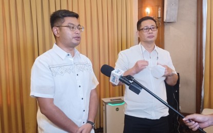 <p><strong>TOURISM RECOVERY</strong>. Hotel, Resort and Restaurant Association of Cebu Inc. (HRRACI) executive vice president Carlo Anton Suarez (left) and HRACCI president Alfred Reyes are interviewed by a television reporter at the sideline of the Open Line forum at the Casino Español in Cebu City on Tuesday (June 14, 2022). Suarez said hotels, resorts, and restaurants are expecting Japanese and Korean tourists to be back in Cebu by the third or fourth quarter of 2022.<em> (PNA photo by John Rey Saavedra)</em></p>