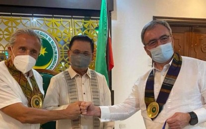 <p><strong>SUPPORT FOR EX-MILF.</strong> UN Resident Coordinator to the Philippines Gustavo Gonzalez, Chief Minister Ahod "Murad" Ebrahim of the Bangsamoro Autonomous Region in Muslim Mindanao (BARMM), and EU Ambassador Luc Véron during a meeting on June 14, 2022 prior to the launch of the two programs. The projects will support Camp Bilal in Lanao provinces, Camp Bushra in Lanao del Sur, Camp Abubakar in Maguindanao, Camp Rajamuda in North Cotabato/Maguindanao, and Camps Badre and Omar in Maguindanao. <em>(Photo courtesy of EU Delegation in Manila)</em></p>