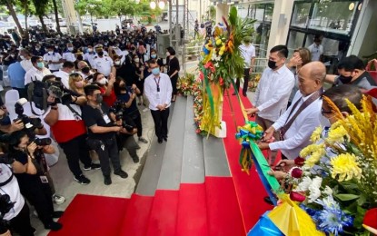 <p><strong>NEW OCD BUILDING.</strong> Defense Secretary Delfin Lorenzana (right) leads the inauguration of the newly completed seven-story administration building of the Office of Civil Defense (OCD) in Camp Aguinaldo, Quezon City on Tuesday (June 14, 2022). Lorenzana said the building's state-of-the-art facilities would connect OCD directly to local government units, making its services more proactive, coordinated, and efficient. <em>(Photo courtesy of Secretary Delfin Lorenzana’s Facebook page)</em></p>