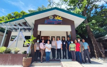 <p><strong>PREREQUISITE</strong>. Officials of the Philippine Drug Enforcement Agency in Pangasinan province and the local government unit of Balungao town pose in front of the Balay Silangan reformation center during its inauguration on June 13, 2022. The town was declared drug-cleared in December 2022 following its opening.<em> (Photo courtesy of PDEA Pangasinan)</em></p>