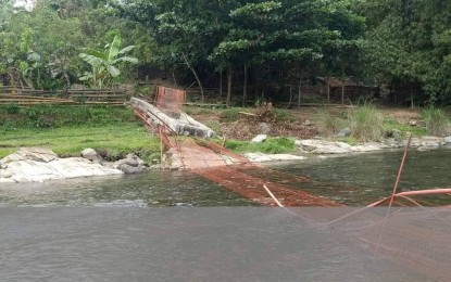 <p><strong>CRUMBLED</strong>. The hanging footbridge in Barangay Latazon in Laua-an town, Antique province collapsed injuring one personnel of the Department of Trade and Industry provincial office and its two on-the-job trainees on Wednesday (June 15, 2022). The bridge collapsed due to overloading, according to Antique Provincial Disaster Risk Reduction and Management Officer Broderick Train.<em> (Photo courtesy of Arlene Pedro)</em></p>