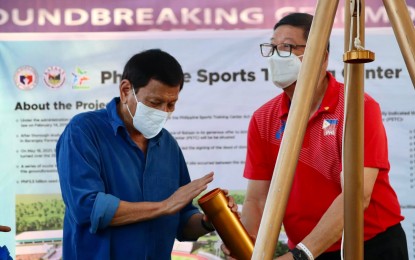 <p><strong>NEW FACILITY.</strong> President Rodrigo Duterte (left) and Philippine Sports Commission chief William Ramirez bury the time capsule at the groundbreaking ceremony of the Philippine Sports Training Center in Bagac, Bataan on Friday (June 17, 2022). Duterte is hoping the next administration will support projects for the benefit of national athletes. <em>(Photo courtesy of PSC)</em></p>