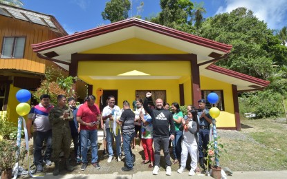 <p><strong>BDP PROJECT.</strong> Davao de Oro Governor Jayvee Tyron Uy (raising his hand) leads the turnover of the  barangay health center, a Barangay Development Program project in Sitio Manasa, Barangay Anitapan in Mabini, Davao de Oro, on June 14, 2022. The BDP aims to eradicate the root causes of the insurgency, poverty, and social injustice in remote communities across the country identified to have been influenced by the communist armed rebellion. <em>(Photo courtesy of Davao de Oro PIO)</em></p>