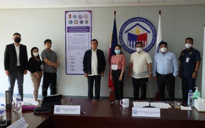 <p><strong>FIGHT VS. REAL ESTATE SCAMS.</strong> Housing Secretary Eduardo Del Rosario (4th from left) and representatives of partner agencies launch the National Task Force on Anti-Illegal Real Estate Practice in Quezon City on Saturday (July 18, 2022). The task force aims to end illegal real estate transactions that rob prospective buyers of their hard-earned money.<em> (Photo courtesy of DHSUD-CDMRD)</em></p>