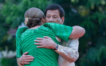 <p><strong>FAVORITE CHILD.</strong> Vice President-elect Sara Duterte gives her father, President Rodrigo Duterte, a tight hug after she took her oath at San Pedro Square, Davao City on Sunday (June 19, 2022). Despite alleged misunderstandings, former presidential spokesperson Harry Roque said the younger Duterte is the President’s favorite child. <em>(Presidential Photos)</em></p>