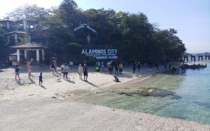 <p><strong>HUNDRED ISLANDS.</strong> Tourists enjoy the white sand beach in Quezon Island, one of the attractions in the Hundred Islands National Park in Alaminos City, Pangasinan. The tourist arrivals in the national park have been increasing since the province has been placed under Alert Level 1. <em>(Photo courtesy of LGU Alaminos)</em></p>