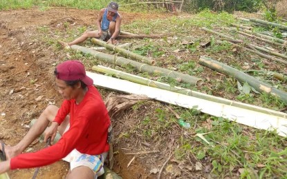 <p><strong>LIVELIHOOD PROJECT.</strong> Members of Kryz Culinary Arts and Restaurant Services Institute Farmers Association prepare for the launch of their sow-level swine multiplier and techno-demo farm project in Bingawan, Iloilo on Tuesday (June 21, 2022). The project to be launched on June 27 is a grant from the Agricultural Training Institute as part of the Department of Agriculture’s recovery and repopulation plan for the swine industry.<em> (Photo courtesy of Concepcion Carillo)</em></p>