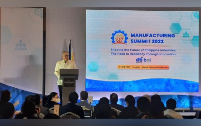 <p><strong>MANUFACTURING SUMMIT.</strong> Outgoing Trade Secretary Ramon Lopez delivers his speech during the 7th Manufacturing Summit at Makati Diamond Residences in Makati City on June 21, 2022. The DTI chief wants refinement in the government procurement law that will favor local manufacturers in certain procurement projects.<em> (PNA photo by Kris Crismundo)</em></p>