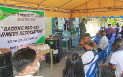 <p><strong>ASSISTANCE.</strong> Former communist terrorist group supporters in Barangay San Jose in Licab town, Nueva Ecija province receive government livelihood assistance on Monday (June 20, 2022). The former members of the Communist Affiliated Mass Organization were awarded a mushroom production livelihood starter kit. <em>(Photo courtesy of 7th Infantry Division, PA)</em></p>